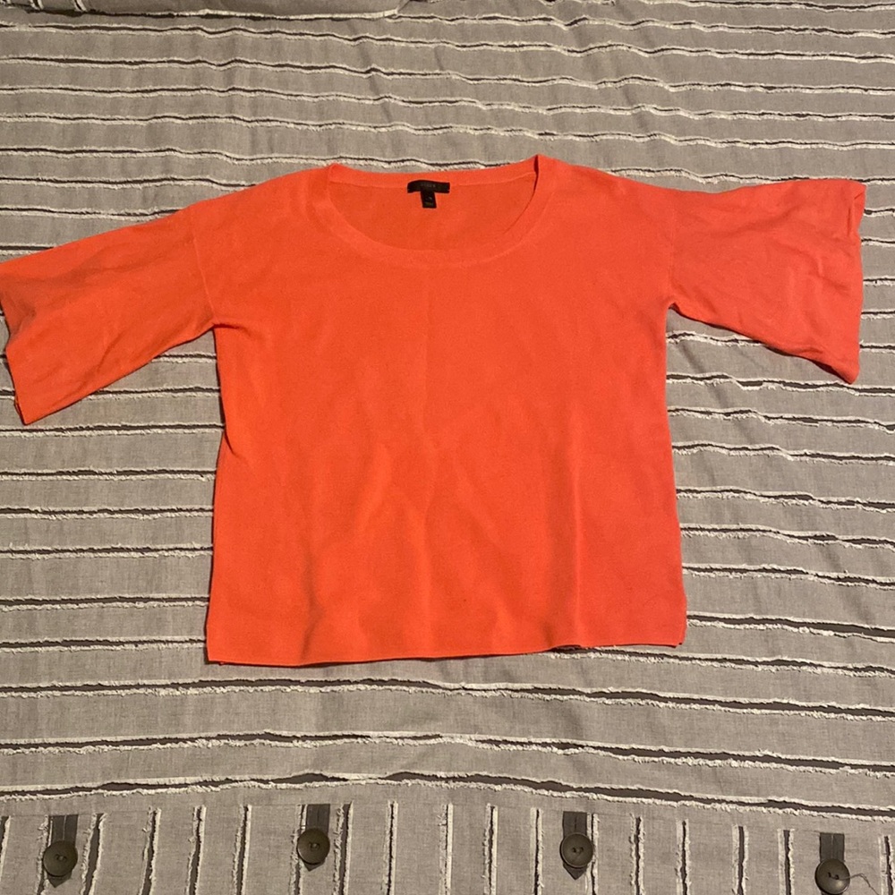 Coral J Crew sweater with a light flutter detail on the sleeves